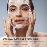 Woman applying a facial cleansing bar to her face with text about Schizandu Lemon Poppy Seed Bar.