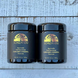 Schizandu ayurvedic curcumin gingerol herbal supplements in black jars on a wood background