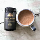 Curcumin Highest Conventration 98 percent curcuminoids package and prepared version on a table, Schizandu