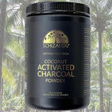Container of Schizandu coconut activated charcoal powder with palm trees in the background