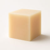 Vegan shampoo bar with herbal ingredients for natural hair care.