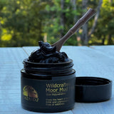 Jar of Schizandu wildcrafted moor mud mask with smooth dark texture.