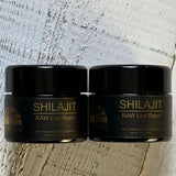 A jar of SHILAJIT RAW Live Resin, with the brand name and product name visible, on a wooden surface.