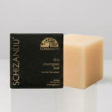 Schizandu shampoo bar and packaging on a white background
