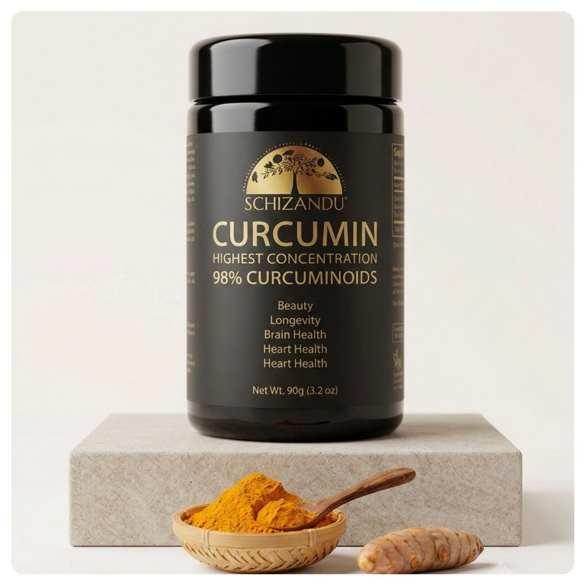 A black jar of Schizandu Curcumin with gold lettering, displayed on a light gray block with a small woven bowl of yellow turmeric powder and a turmeric root in front, against a clean white background.