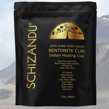 Black package of Schizandu Bentonite Clay with gold text against a mountainous background