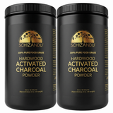 Two containers of Schizandu hardwood activated charcoal powder on a white background