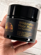 Wildcrafted Moor Mud Mask package in a hand, Schizandu