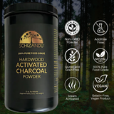 Black container of Schizandu hardwood activated charcoal powder with certification icons on a forest background
