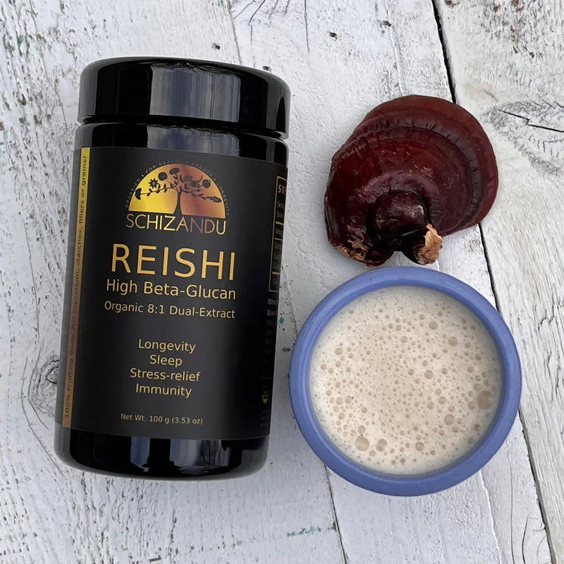 Organic Reishi Extract supplement beside a herbal tonic drink