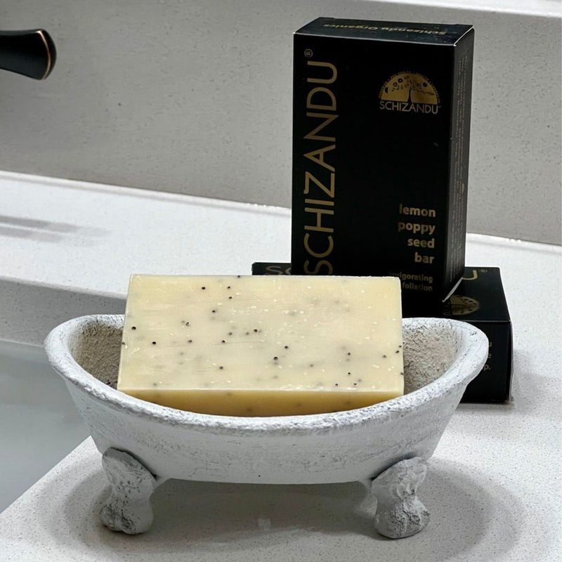 Bar of soap in a decorative dish with Schizandu packaging in the background