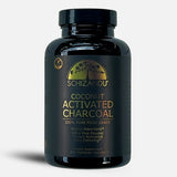 Black bottle of Schizandu Coconut Activated Charcoal on a white background