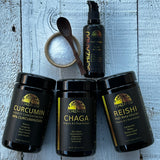 Collection of black containers labeled Curcumin, Chaga, and Reishi on a textured blue surface.