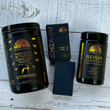Family detox care kit of Schizandu Harwood, pet charcoal, black charcoal detox bar, and reishi mushroom on a wooden surface 